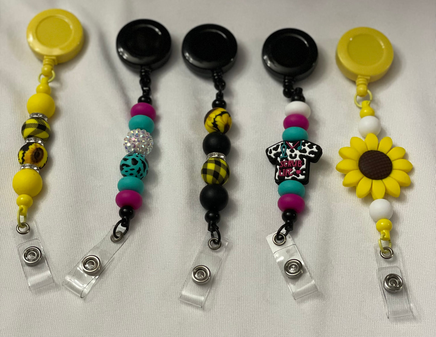 Badge reels with beads