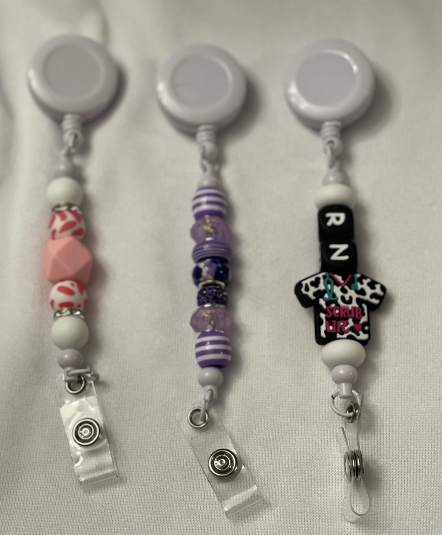 Badge reels with beads