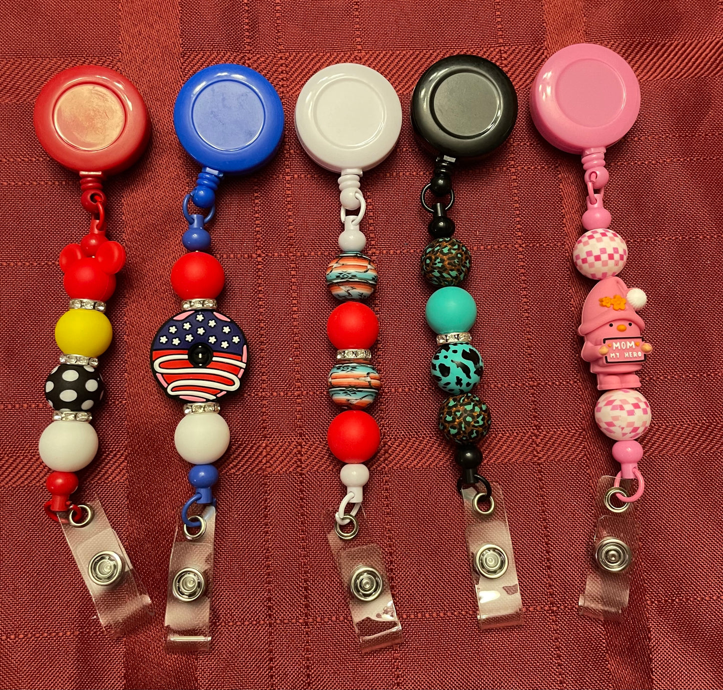 Badge reels with beads