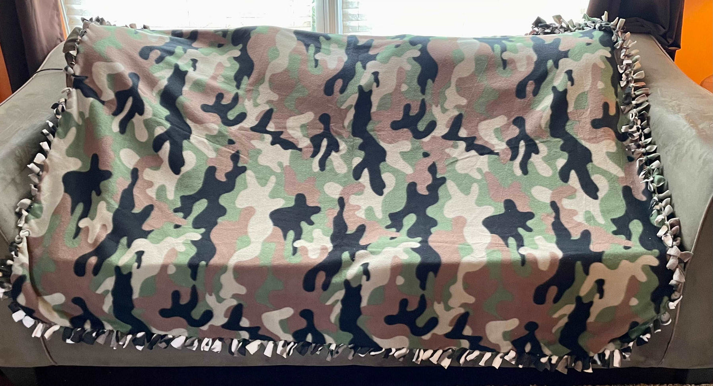 Cuddle up and stay warm with one of my medium size fleece tie knot blankets