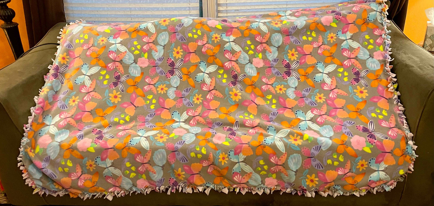 Cuddle up and stay warm with one of my medium size fleece tie knot blankets