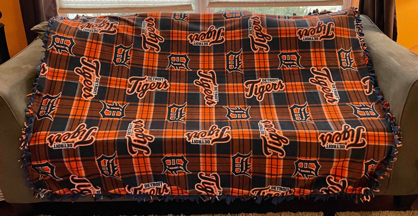 Cuddle up and stay warm with one of my medium size fleece tie knot blankets
