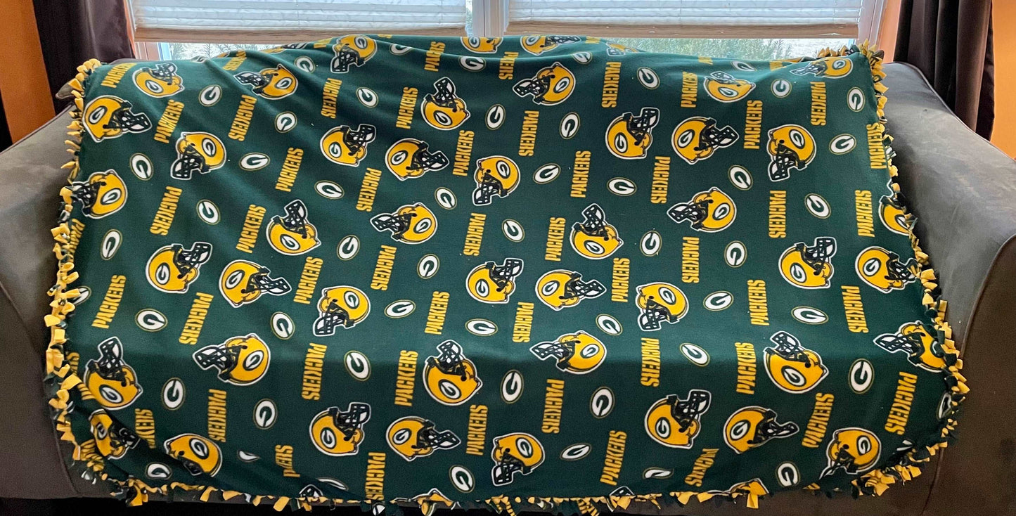 Cuddle up and stay warm with one of my medium size fleece tie knot blankets