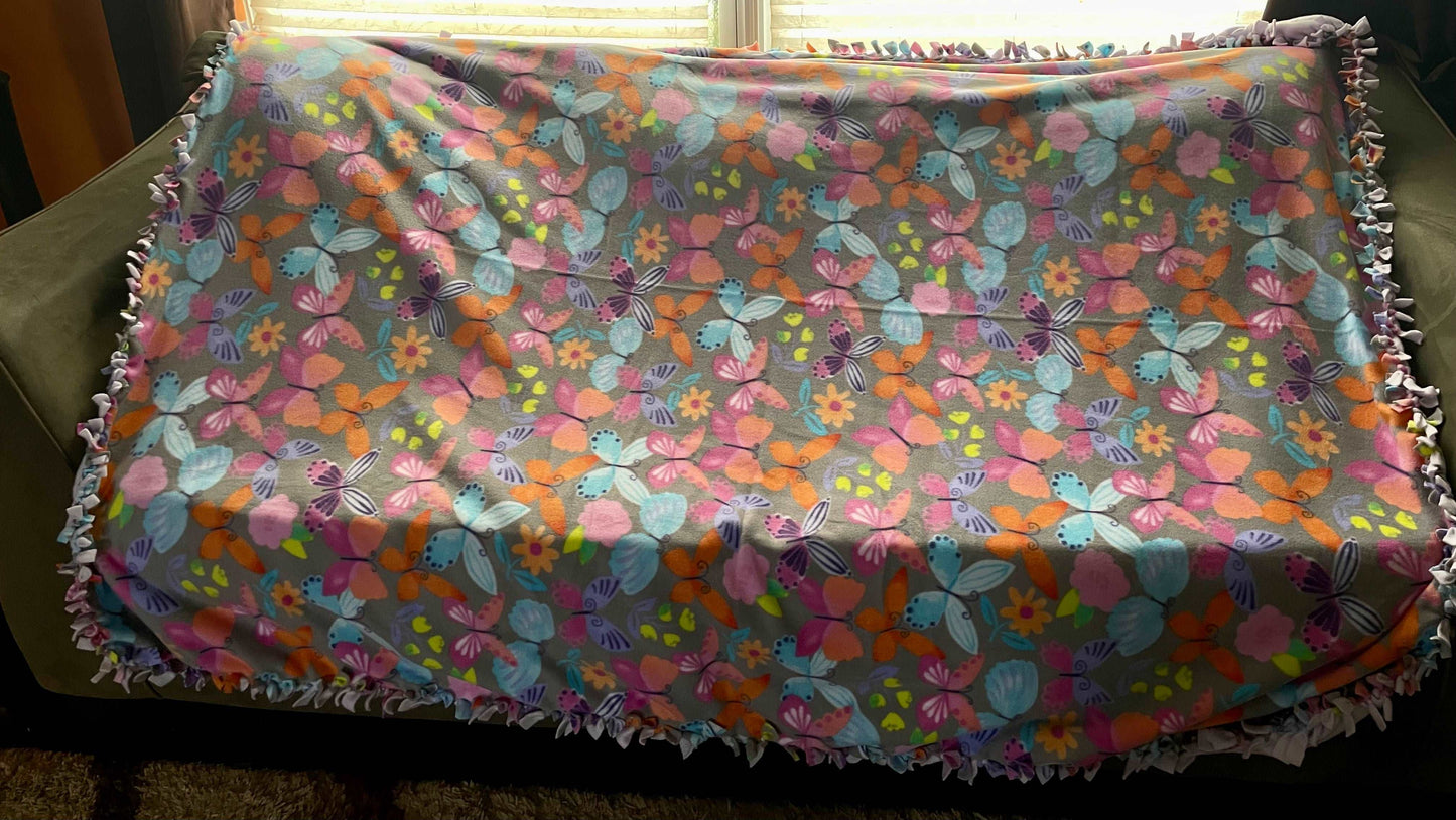 Cuddle up and stay warm with one of my medium size fleece tie knot blankets