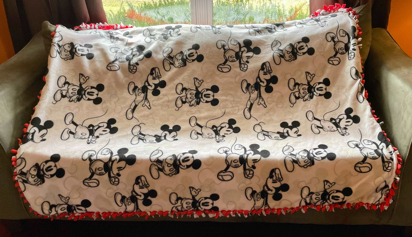 Cuddle up and stay warm with one of my medium size fleece tie knot blankets