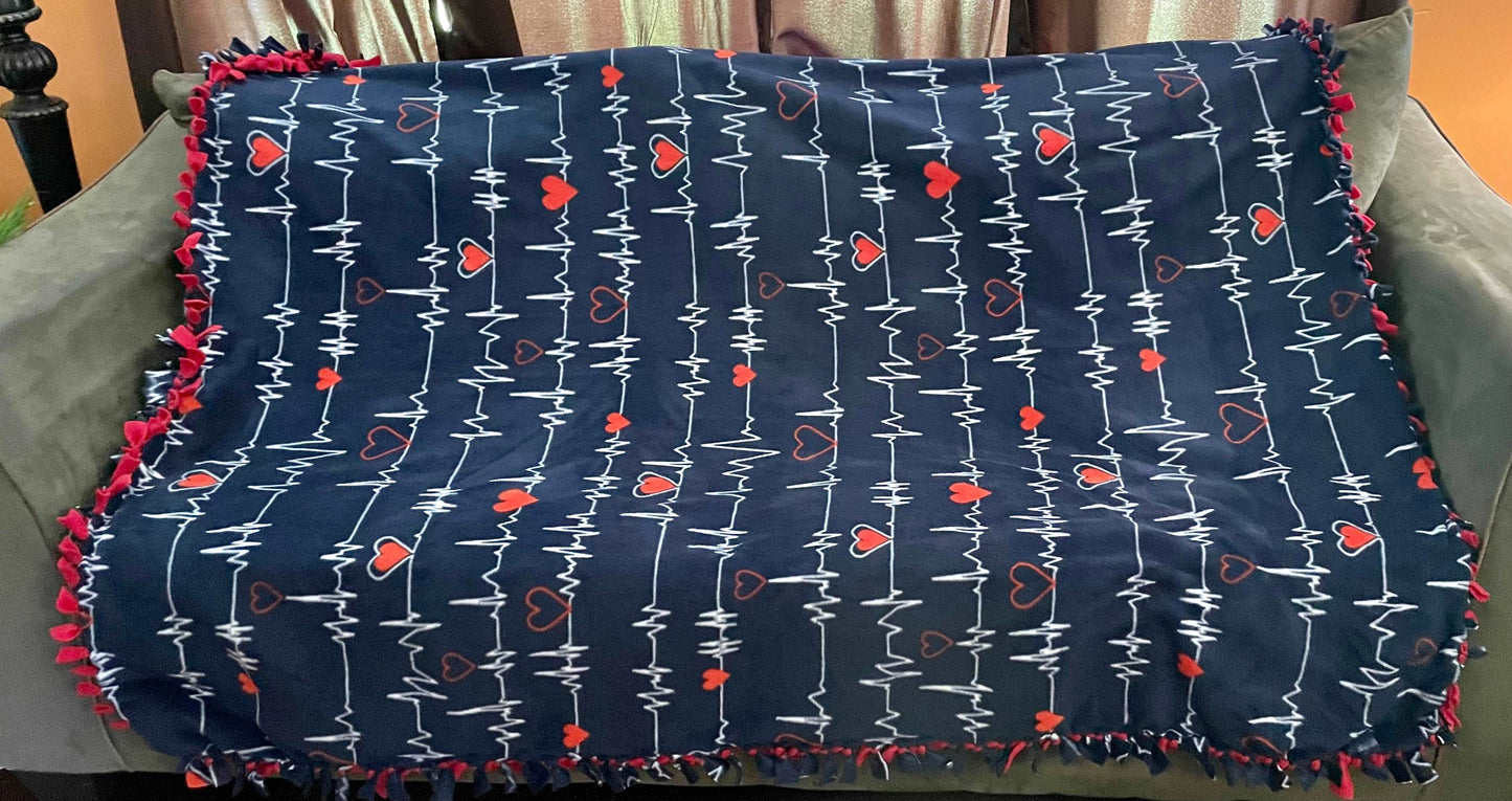 Cuddle up and stay warm with one of my medium size fleece tie knot blankets