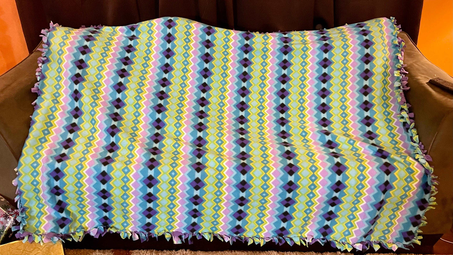 Cuddle up and stay warm with one of my medium size fleece tie knot blankets