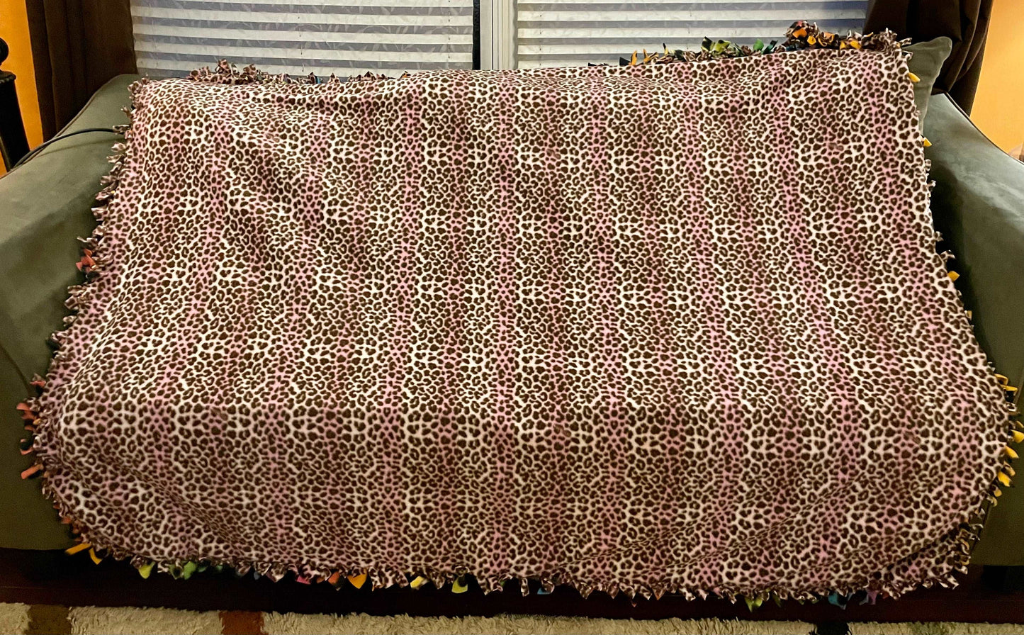 Cuddle up and stay warm with one of my medium size fleece tie knot blankets