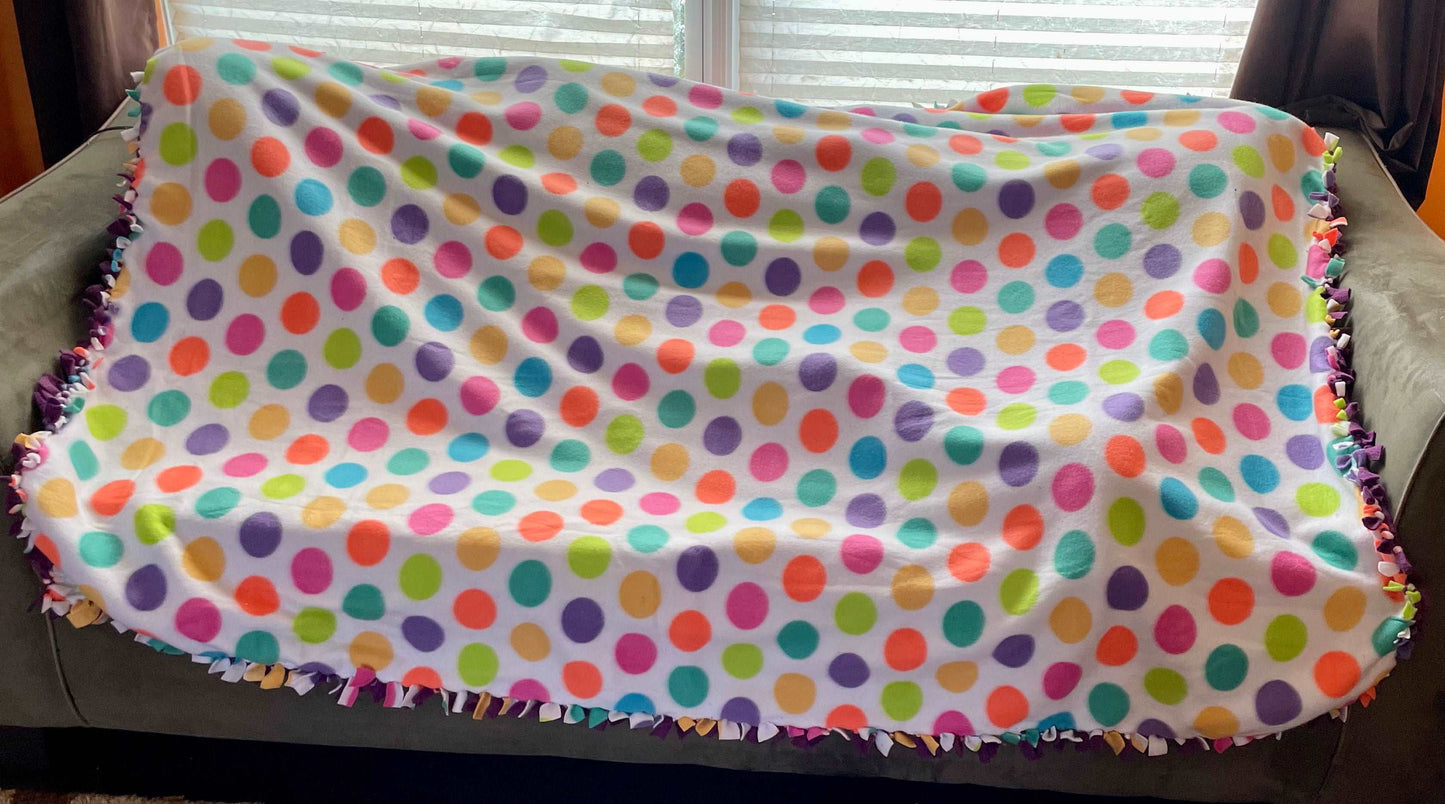 Cuddle up and stay warm with one of my medium size fleece tie knot blankets