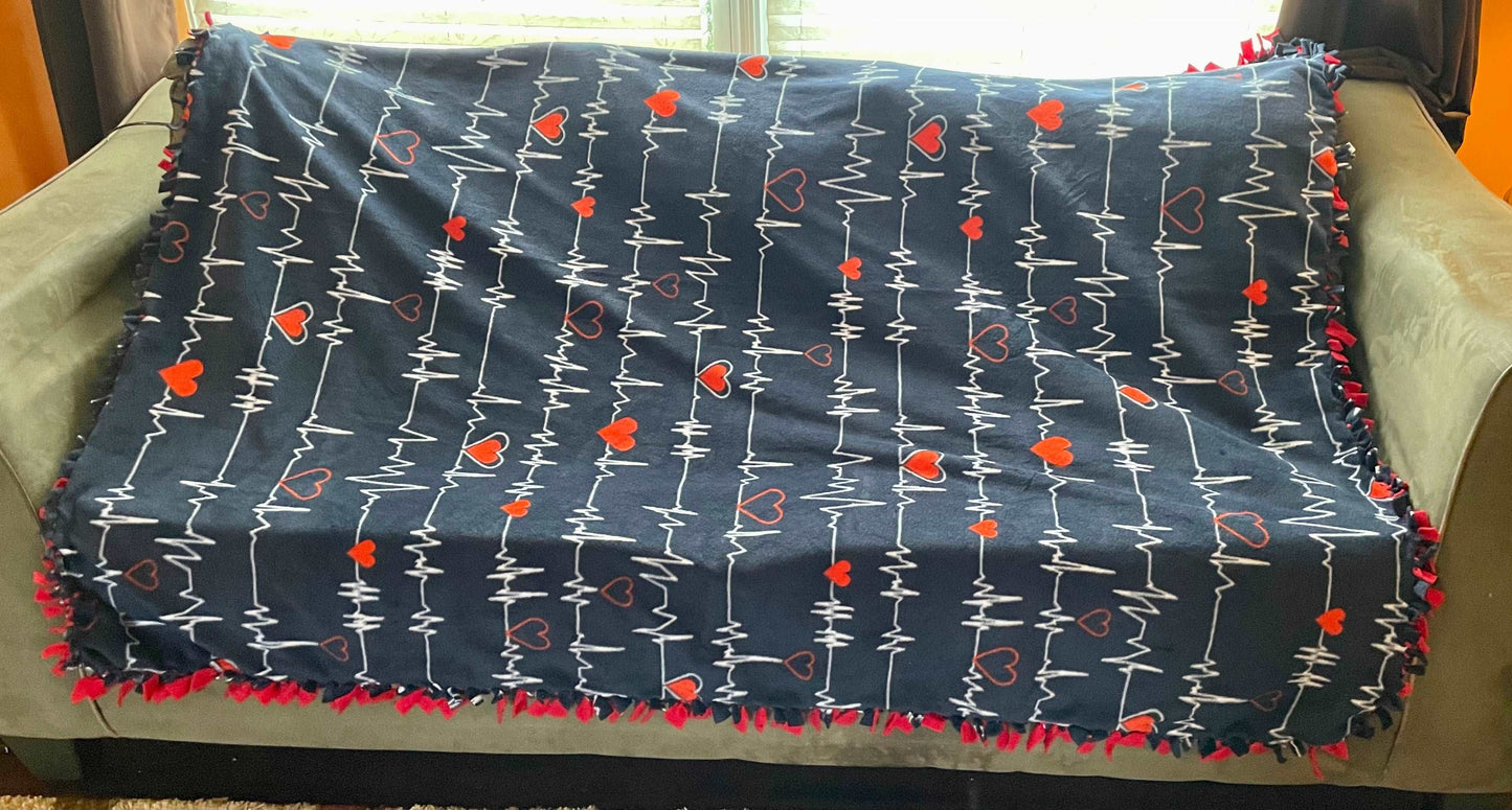 Cuddle up and stay warm with one of my medium size fleece tie knot blankets