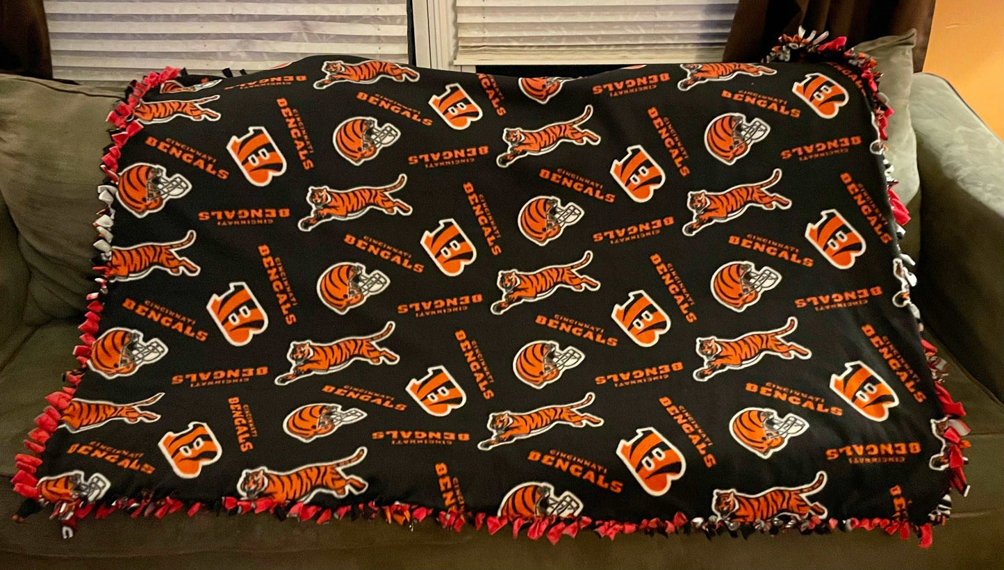 Cuddle up and stay warm with one of my medium size fleece tie knot blankets