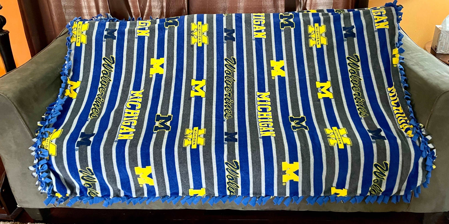 Cuddle up and stay warm with one of my medium size fleece tie knot blankets