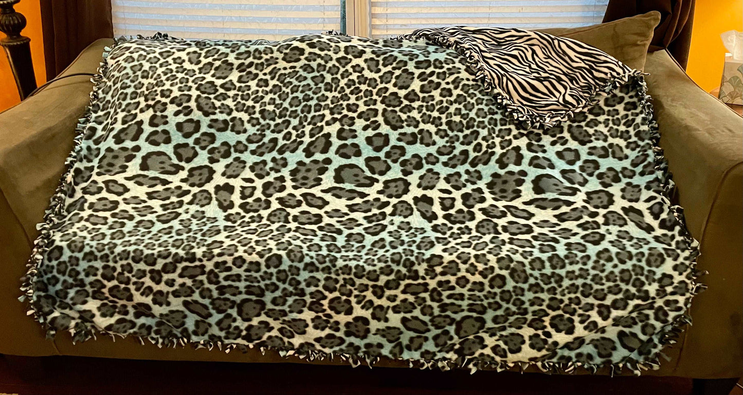 Cuddle up and stay warm with one of my medium size fleece tie knot blankets