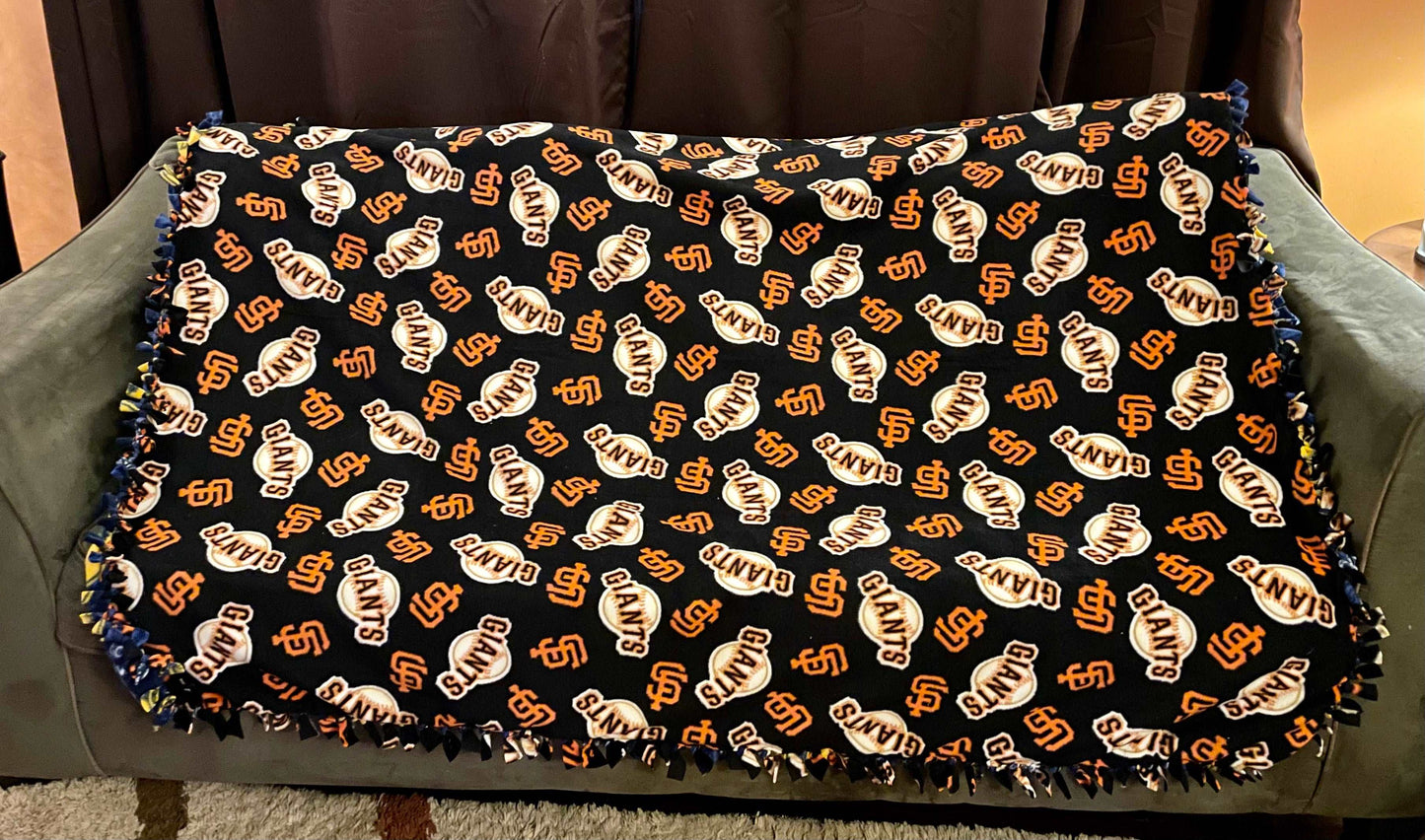 Cuddle up and stay warm with one of my medium size fleece tie knot blankets