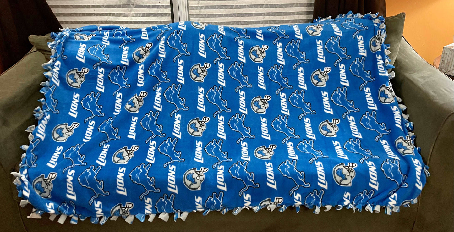 Cuddle up and stay warm with one of my medium size fleece tie knot blankets