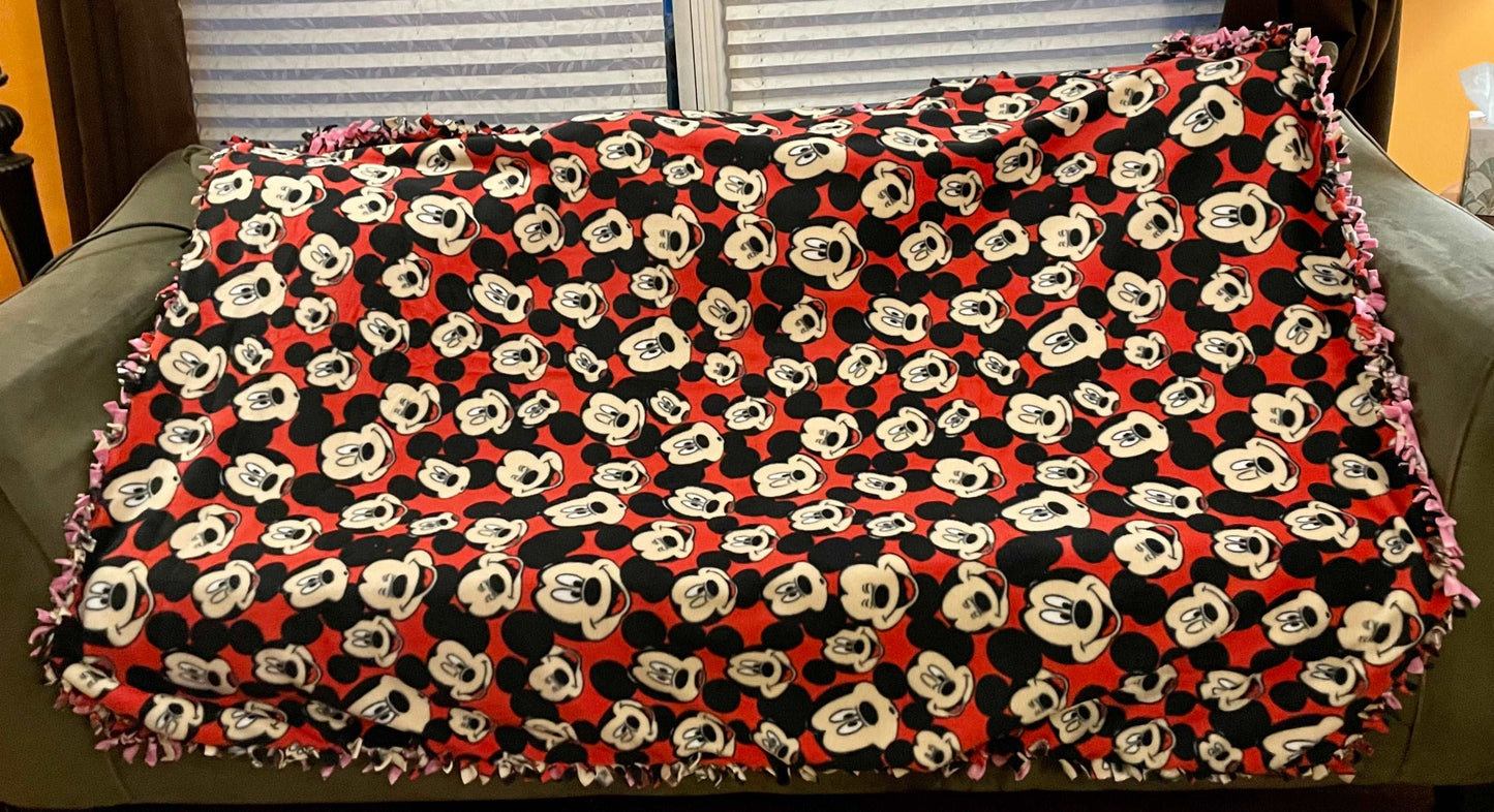 Cuddle up and stay warm with one of my medium size fleece tie knot blankets