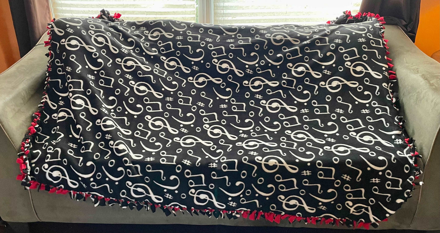 Cuddle up and stay warm with one of my medium size fleece tie knot blankets