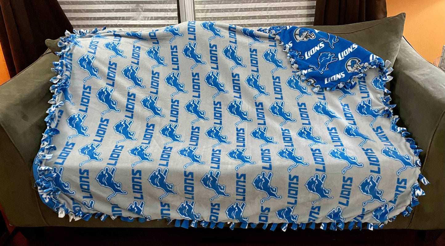 Cuddle up and stay warm with one of my medium size fleece tie knot blankets