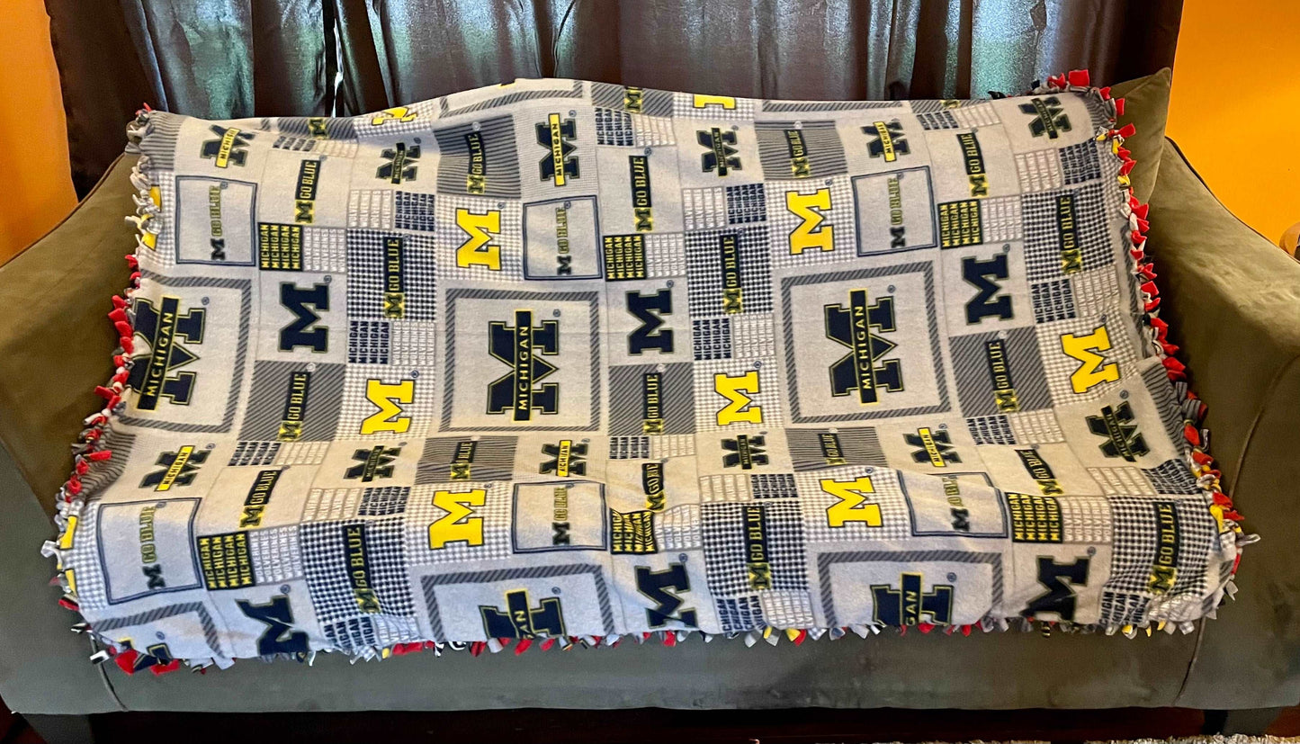 Cuddle up and stay warm with one of my medium size fleece tie knot blankets