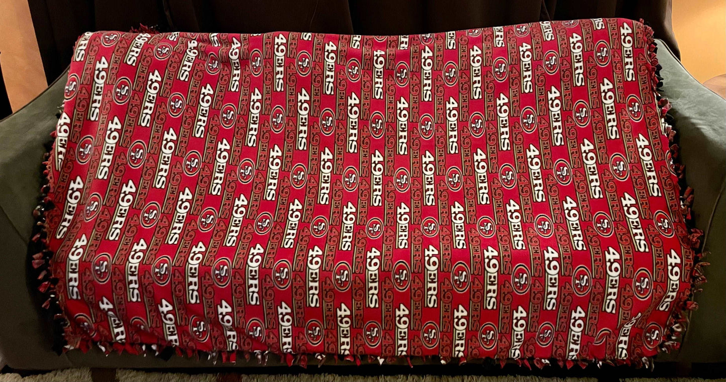 Cuddle up and stay warm with one of my medium size fleece tie knot blankets