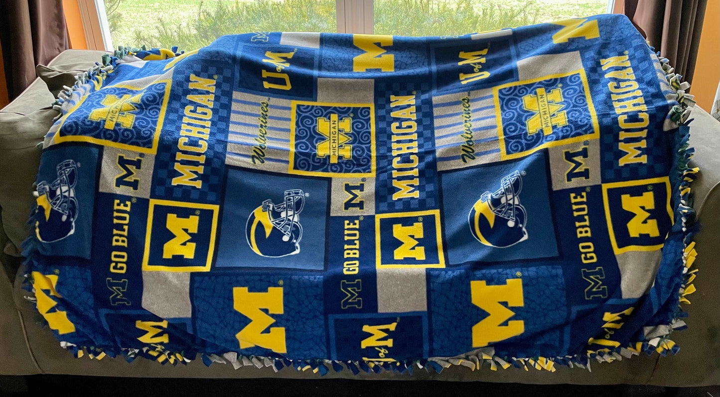 Cuddle up and stay warm with one of my medium size fleece tie knot blankets