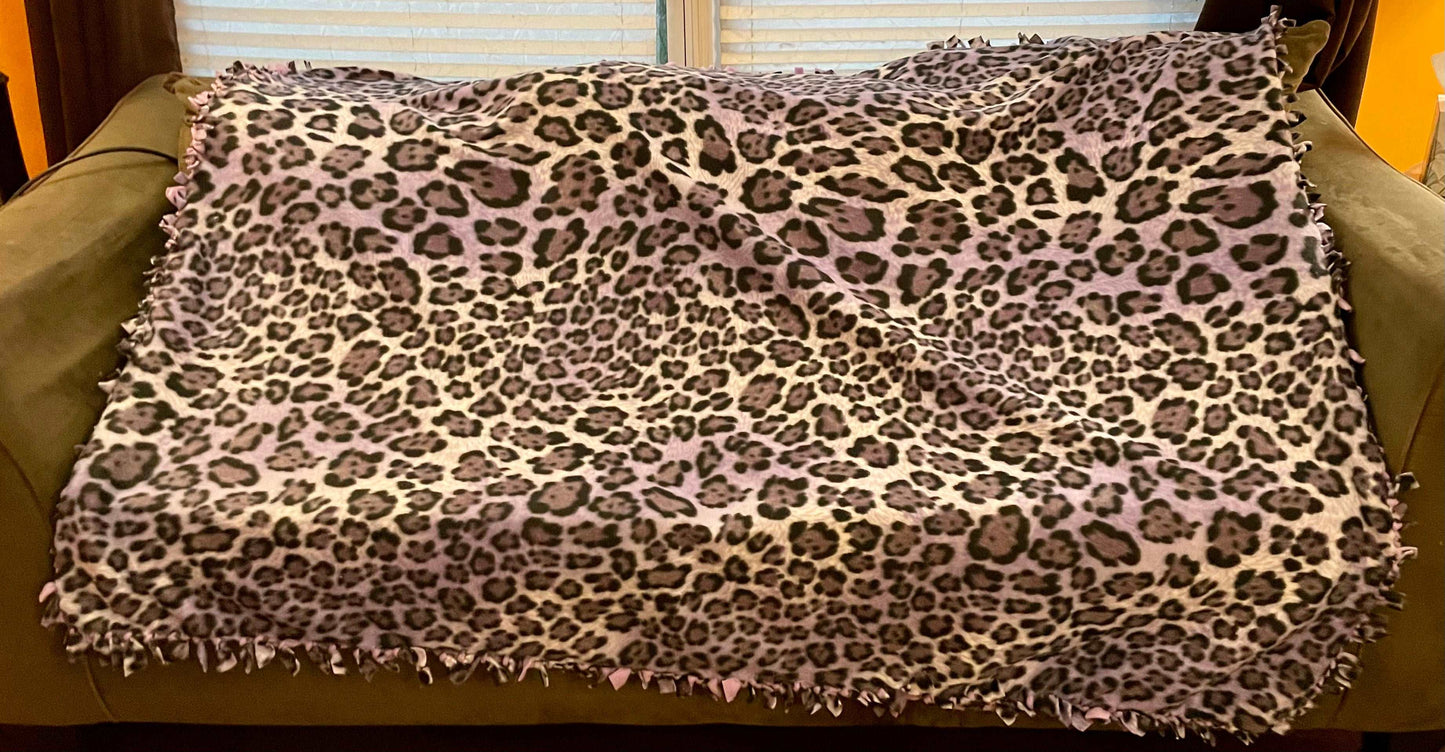 Cuddle up and stay warm with one of my medium size fleece tie knot blankets
