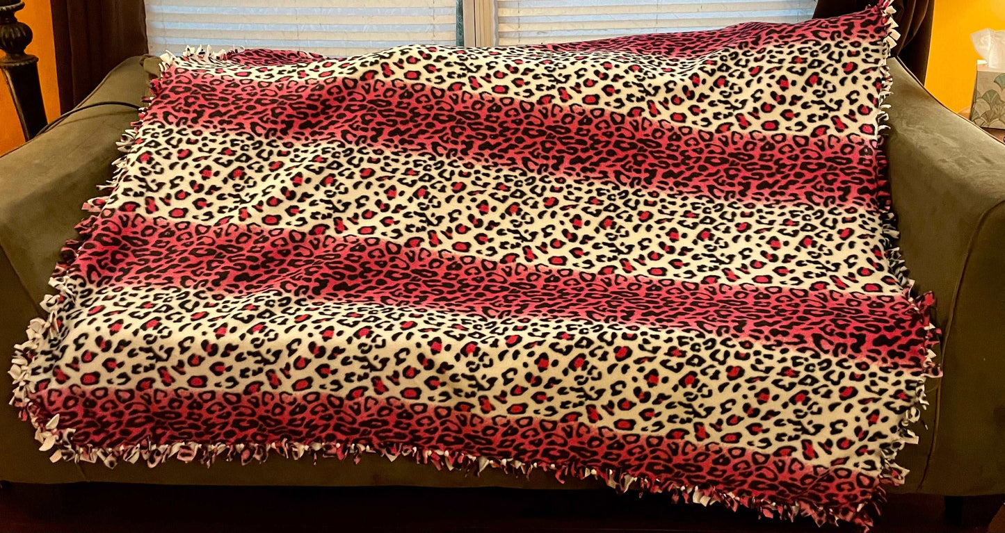Cuddle up and stay warm with one of my medium size fleece tie knot blankets