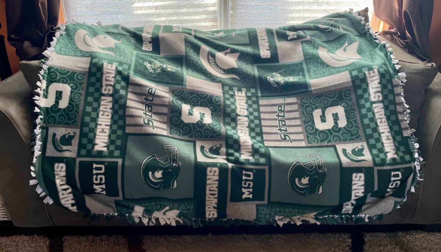 Cuddle up and stay warm with one of my medium size fleece tie knot blankets