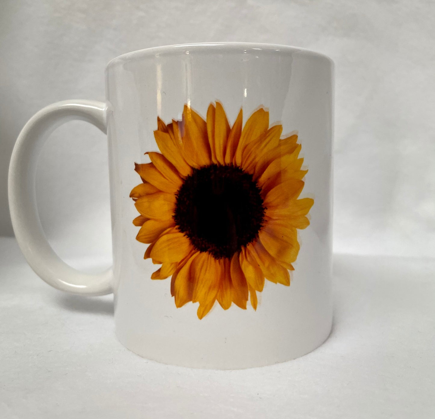 Love Sunflowers? Enjoy your coffee in this 14 ounce ceramic coffee cup!