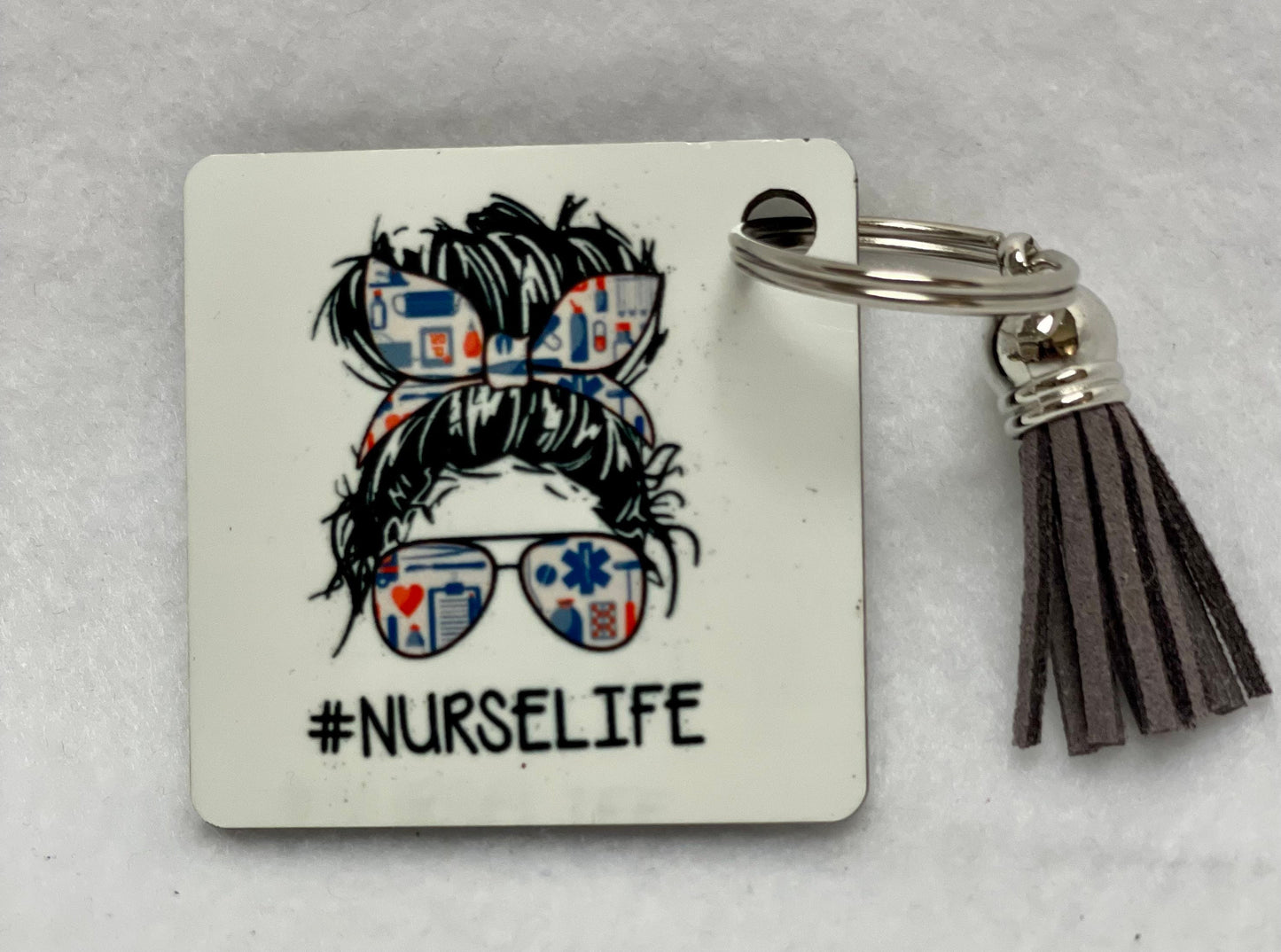 These are key rings with a leather tassel. Please specify in comments which one you are interested in. Each sold separately