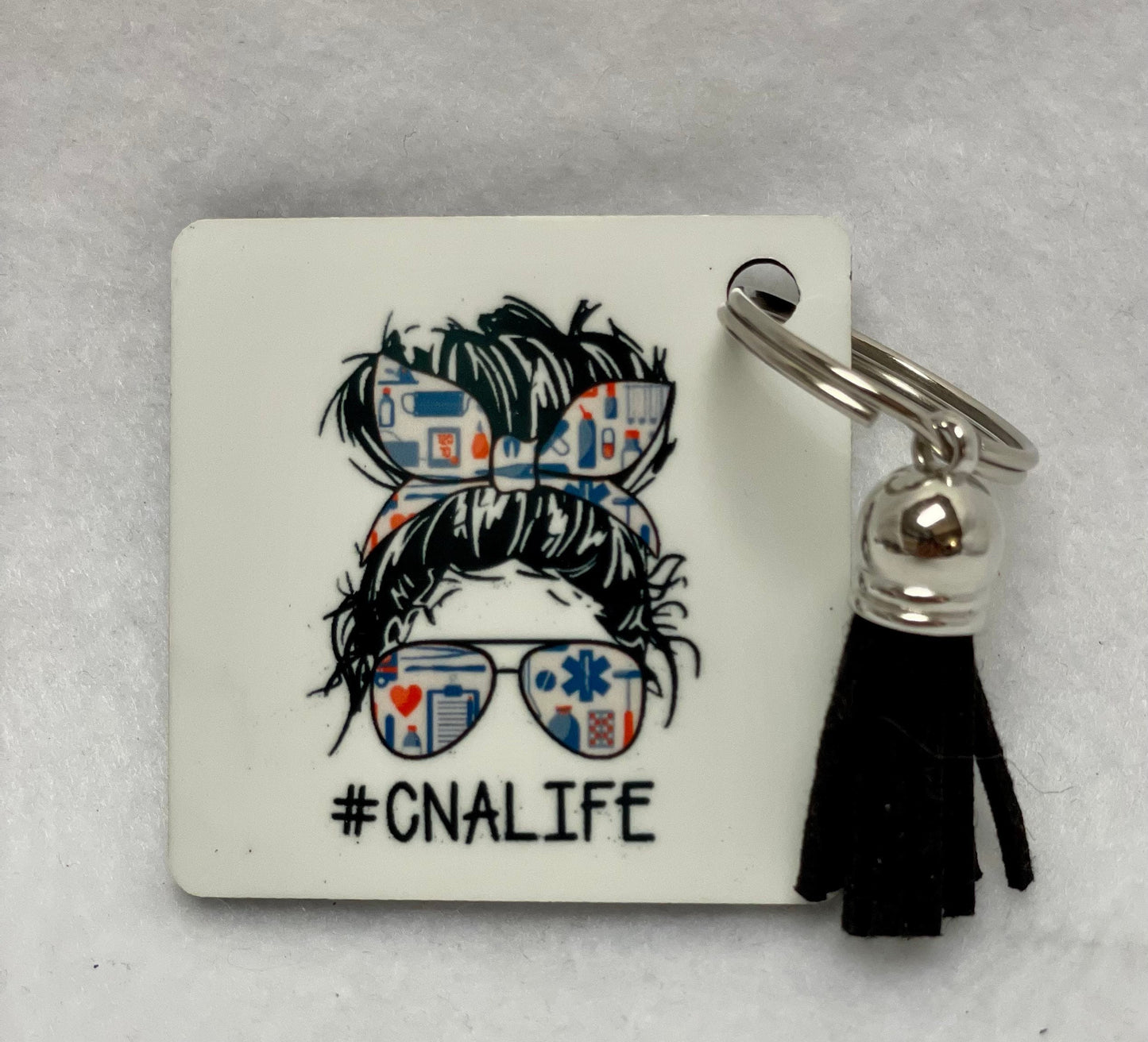 These are key rings with a leather tassel. Please specify in comments which one you are interested in. Each sold separately