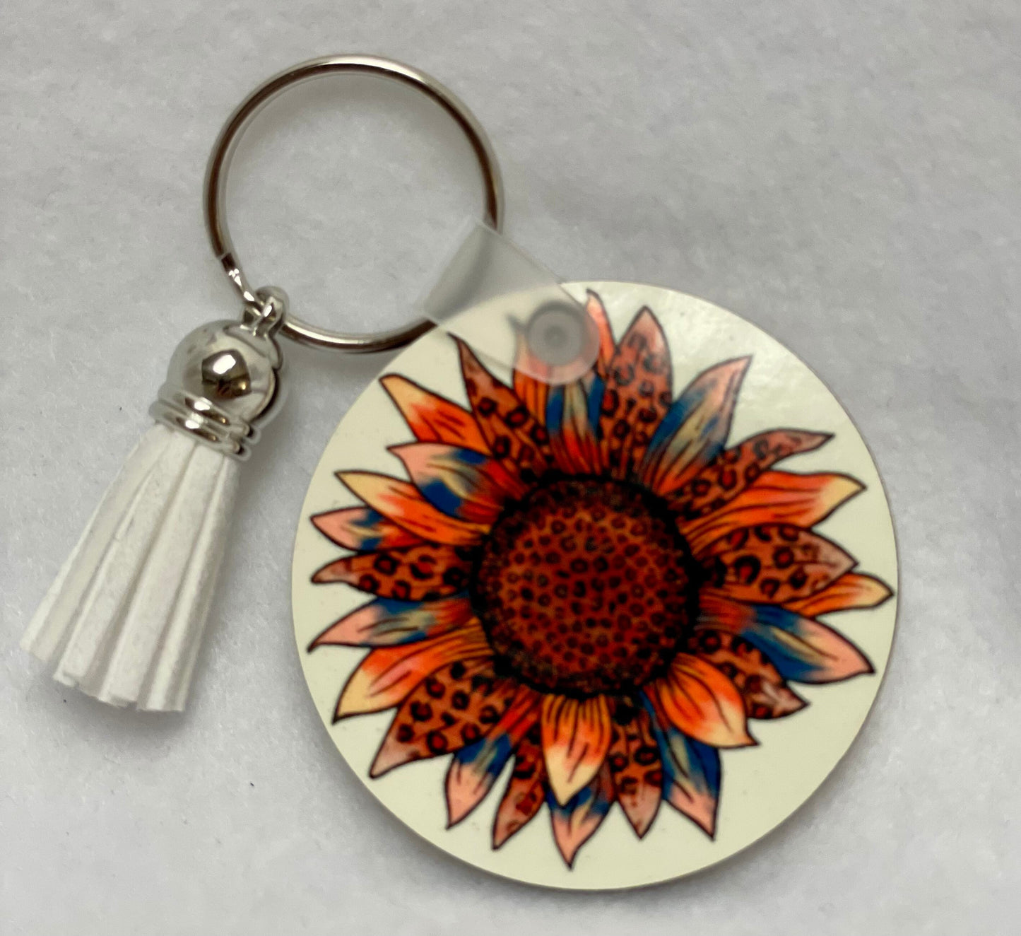 These are key rings with a leather tassel. Please specify in comments which one you are interested in. Each sold separately