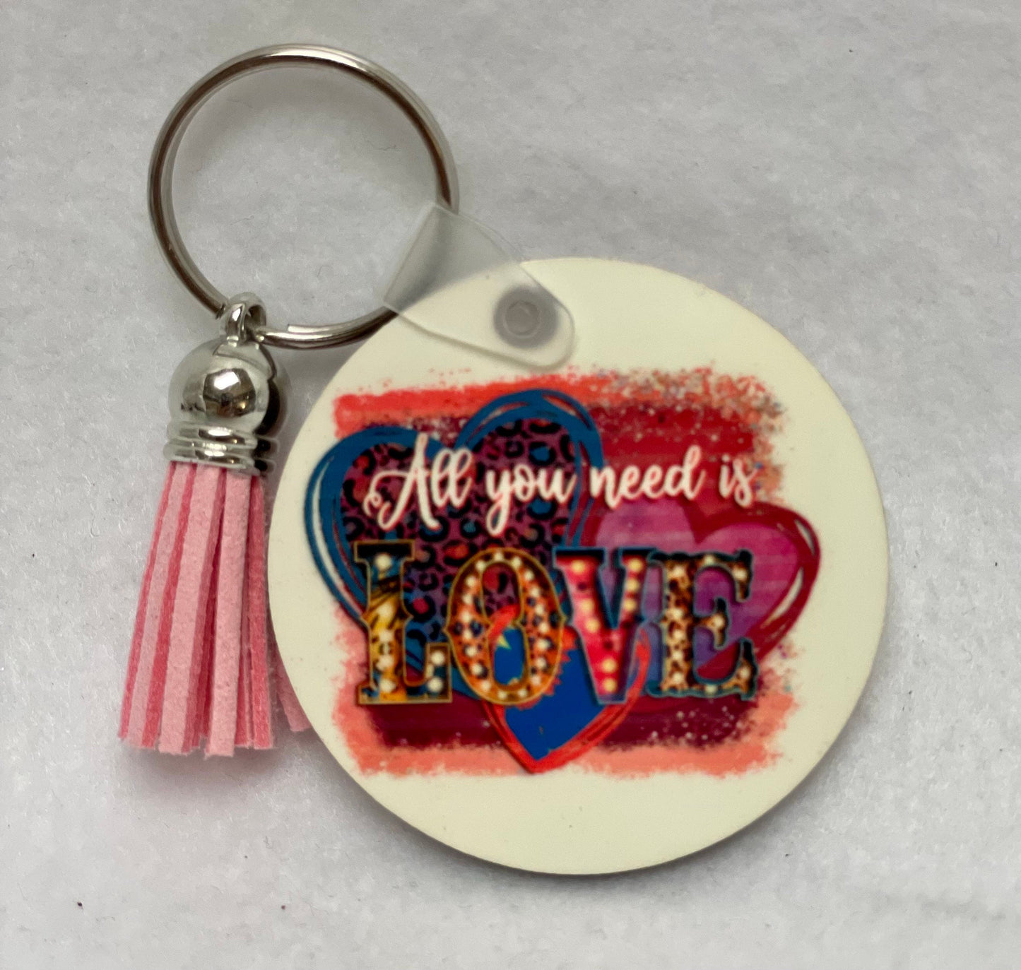 These are key rings with a leather tassel. Please specify in comments which one you are interested in. Each sold separately