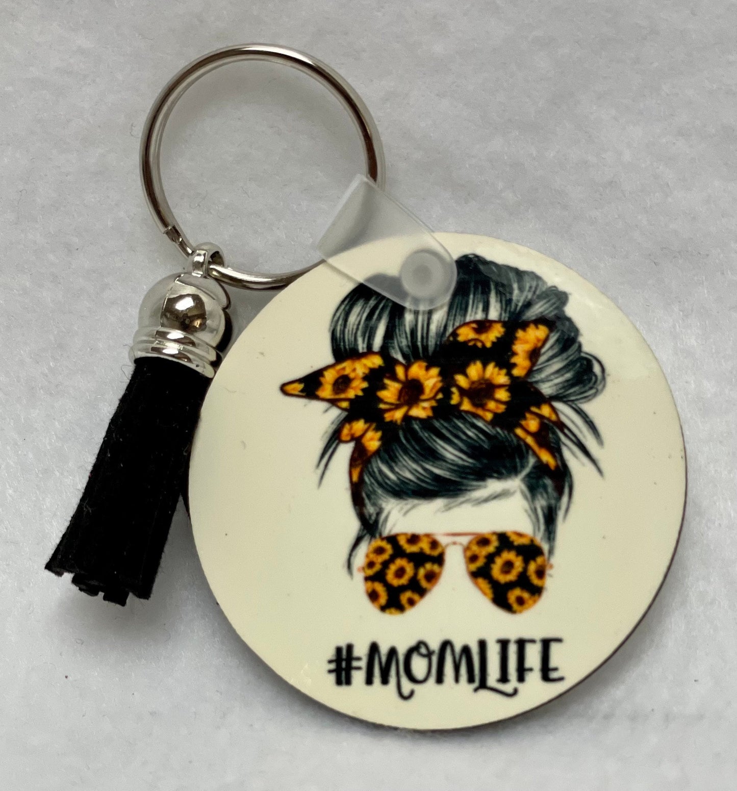 These are key rings with a leather tassel. Please specify in comments which one you are interested in. Each sold separately