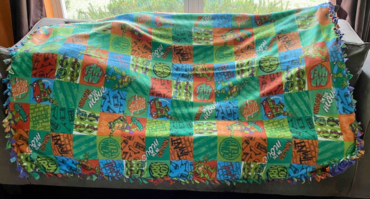 Cuddle up and stay warm with one of my medium size fleece tie knot blankets