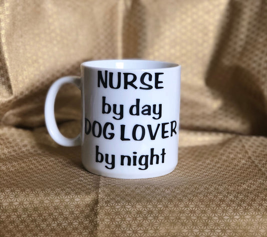 Nurse by day dog lover by night! Enjoy your coffee in this 14 ounce ceramic coffee cup!