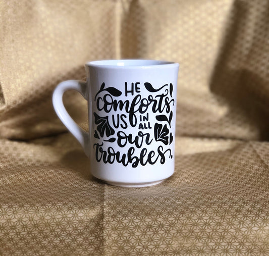 He comforts us.....Enjoy your coffee in this 11 ounce ceramic coffee cup!