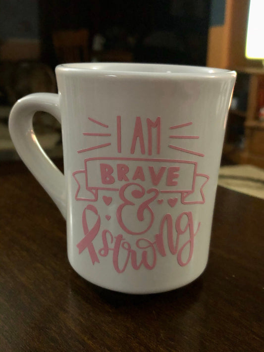I am Brave and Strong coffee cup. Enjoy your coffee in this 11 ounce ceramic coffee cup!