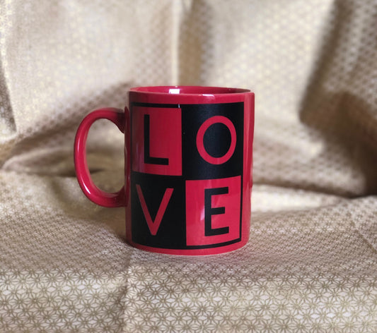 LOVE.... Enjoy your coffee in this 11 ounce ceramic coffee cup!